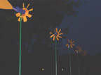 Seven windmills standing at 2.5 metres height, and birdhouse with image inside and special lighting system, 2003.